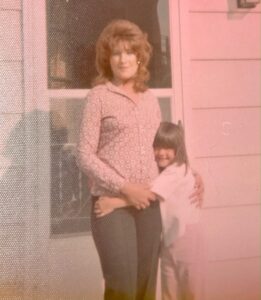 Debbie at age 5 with her momma.